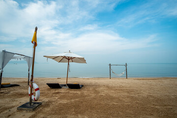 Sun lounge on the beach with blue sky