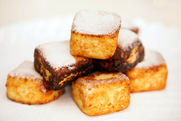 Bakery products. Cheesecakes in the shape of a square. Cottage cheese products.  Hot dish.                                                                                        