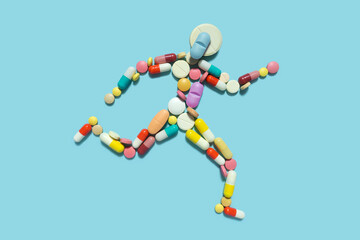 Creative medicine health sport concept photo of man person made of pills drugs running for doping. - obrazy, fototapety, plakaty