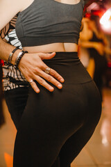 Kharkiv, Ukraine 08.04.21 couple dance bachata salsa dance with beautiful hands. Young sporty girls...