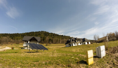 Limanowa, Poland: Wide angle shot of an A shaped houses and solar energy panel photovoltaic panels...