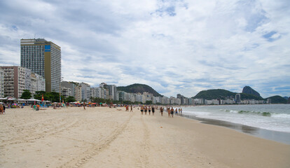   Citizens swim and sunbathe on the beach of Copacabana