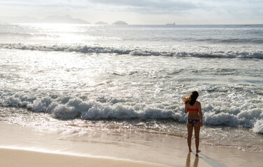   Citizen sunbathe on the beach of Copacabana