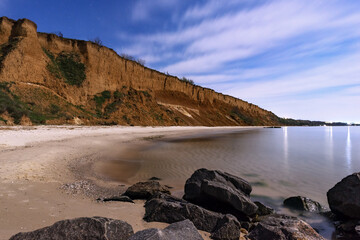 View of the sea on a moonlit night made with long exposure. Ochakov. Ukraine