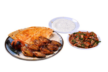 Traditional oriental chicken wing kebab and shashlik skewer with tomato, salad and flatbread on white background. Turkish traditional kebabs. (karisik kebap)