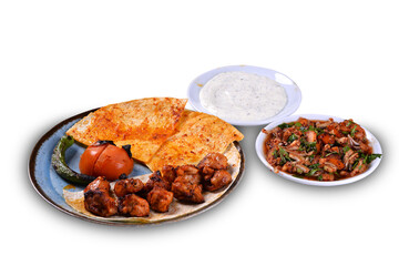 Traditional oriental chicken shish kebab and shashlik skewer with tomato, salad and flatbread on white background. Turkish traditional kebabs. (tavuk sis)