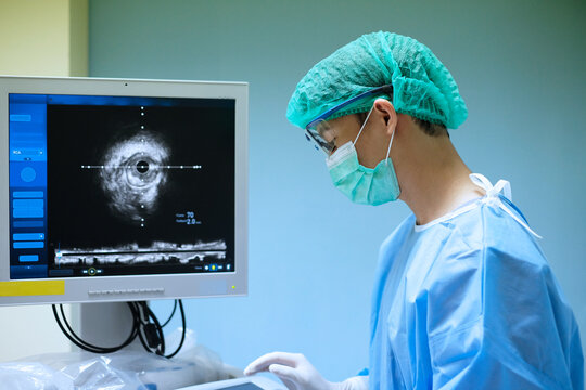 doctor used Intravascular ultrasound imaging (IVUS) machine at cardiac catheterization laboratory room