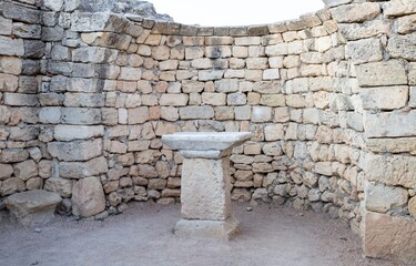 An ancient altar . A place of sacrifice to the gods made of stone surrounded by a stone wall . The religion of the ancient Greeks .