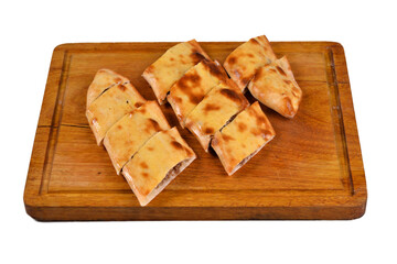 Traditional Turkish Cuisine food cheese pita (pide) with cheddar cheese and braised meat. Turkish cuisine. Turkish pizza Pita (kavurmali kasarli pide) on wood, on white background close up