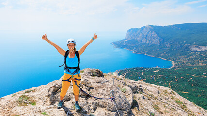 Happy young woman stand on mount top. Amazing sea landscape. Family travel adventure, hiking...