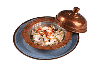 Turkish ravioli - manti yoghurt, 
red pepper and mint. Manti is turkish traditional food in white background. close up