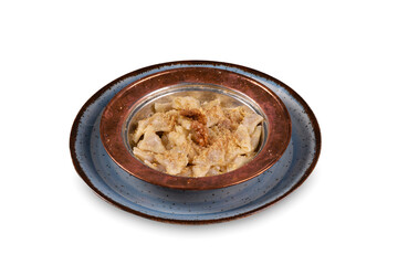 Turkish ravioli - manti (Kastamonu halucka) yoghurt, 
red pepper and mint. Turkish traditional food in white background. old turkish copper plate