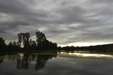 Evening on a calm lake at sunset