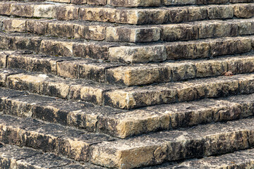 Pyramidal structure made of stones. Stepped structure made of stone blocks. Stone stairs. Pyramid close up.