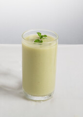 glass of borhani yogurt with mint
