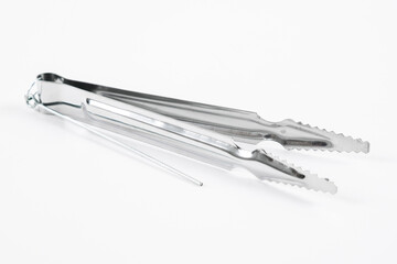 Metal hookah tongs on a white background.