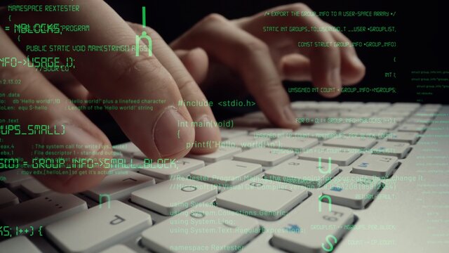 Creative visual of computer programming coding and software development shown by man working on computer keyboard with overlay of computer graphic displaying abstract program codes and computer script