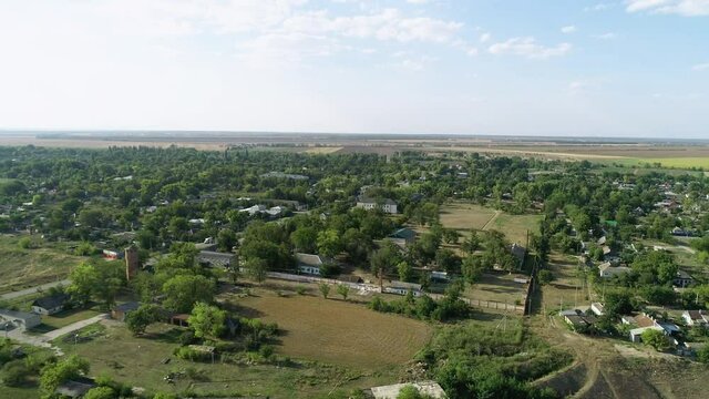 Flight near the village in summer