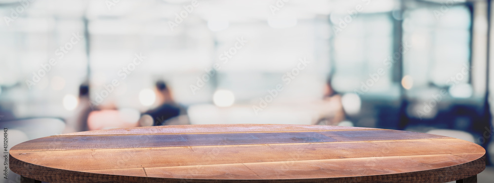 Aufkleber Empty round wood table with cafe restaurant blur background.copy space for display of product on online media advertise