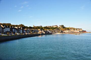 View of the embankment, sea and townhouses. Panoramic view on a summer day.