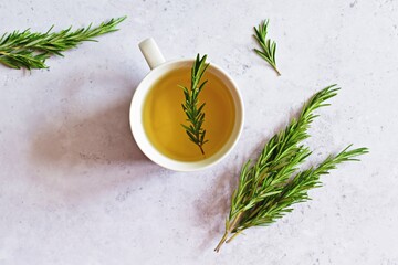 Rosemary tea with honey. Herb tea cup top view