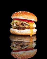 burger with egg and mushroom with a black background