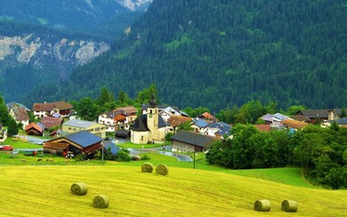 Fototapeta na wymiar Swiss village with a church in the center