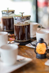 French Press Coffee Maker. Morning concept. coffee siphon. Spent coffee break at the organic cafe and prepare Chocolate or tea in French press.