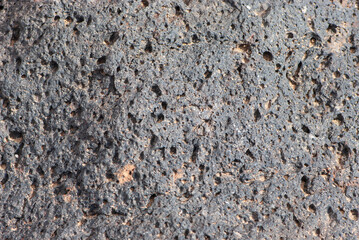 Close-up grunge black stone or rock texture  in nature park of Jandia on deserted island Fuerteventura