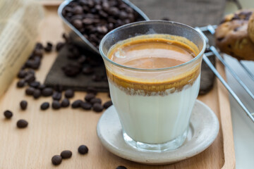 Coffee with condensed milk. Coffee with condensed milk in a transparent glass. Vietnamese coffee with condensed milk in glass cups. Traditional method of making of Vietnamese coffee