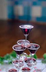 Champagne glass pyramid. Pyramid of glasses of wine, champagne, tower of champagne's glass in wedding reception party