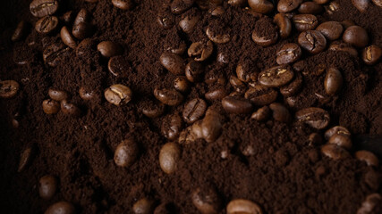 Close up of Brown Arabica Coffee Beans with coffee powder