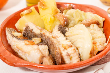 Homemade ray fish with potatos and garlic