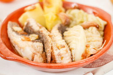 Homemade ray fish with potatos and garlic