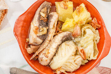 Homemade ray fish with potatos and garlic