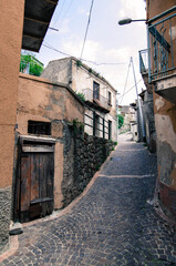 Fototapeta premium Narrow street in old town of Calabria, Italy