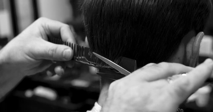 Man haircut in barbershop. Close-up 4K