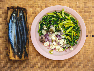 vegetables in a bowl and fish