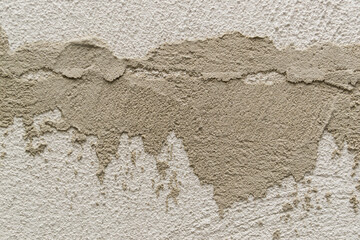 Concrete background. Plaster on the wall. Embossed textured surface.