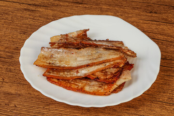 Roasted juicy bacon in the plate