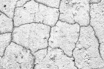 Texture of a concrete wall with cracks and scratches which can be used as a background