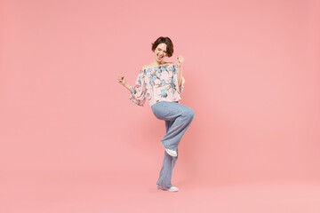 Full length young overjoyed happy caucasian woman with short hairdo in trendy blouse do winner...