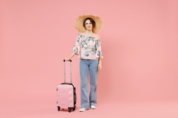 Traveler tourist fun woman 20s wearing summer casual clothes, hat hold suitcase valise isolated on...