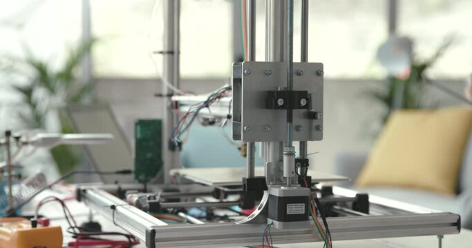 Smart student using a 3D printer in the lab