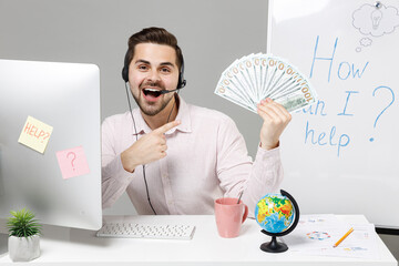 Employee operator business man in set headset for helpline assistance sit work at call center...