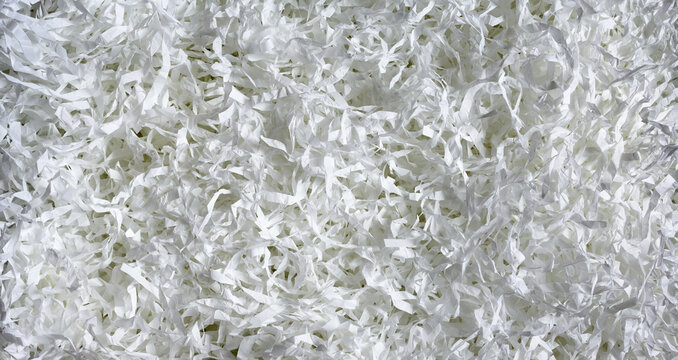 Shredded paper texture background, top view of white paper strips