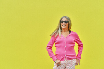 Senior Woman Posing Against Bright Background