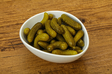 Pickled gherkin in the bowl