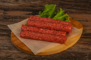 Raw beef sausages with spices