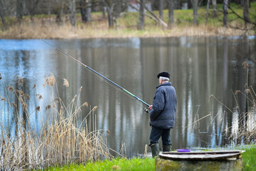 Fototapeta na wymiar Fishing on the river bank in the morning. Latvia.
